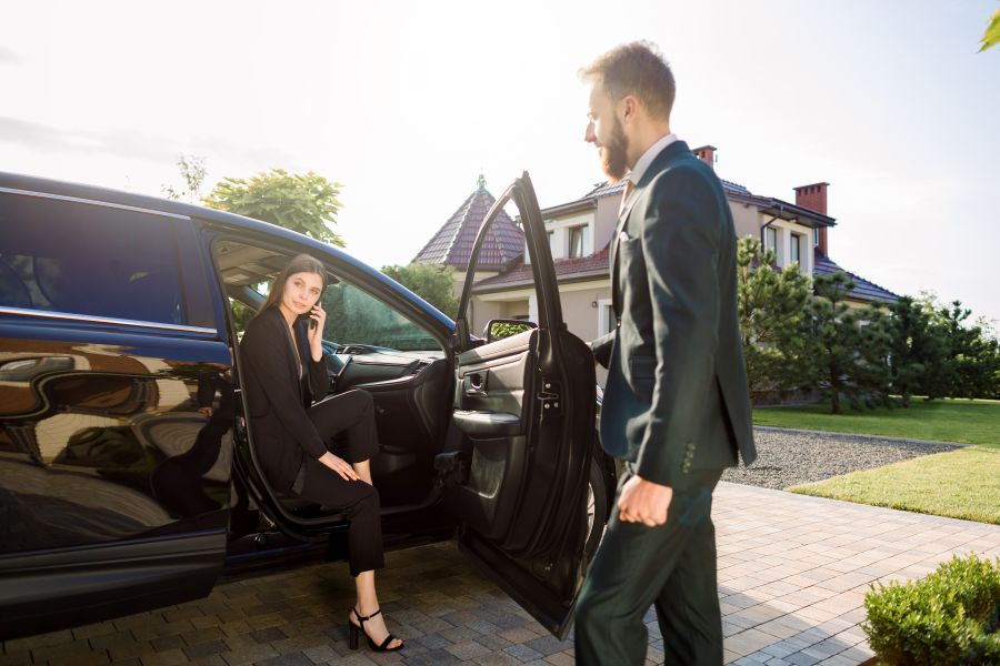 elegant woman arriving by car with chauffeur 2026 01 11 09 43 07 utc