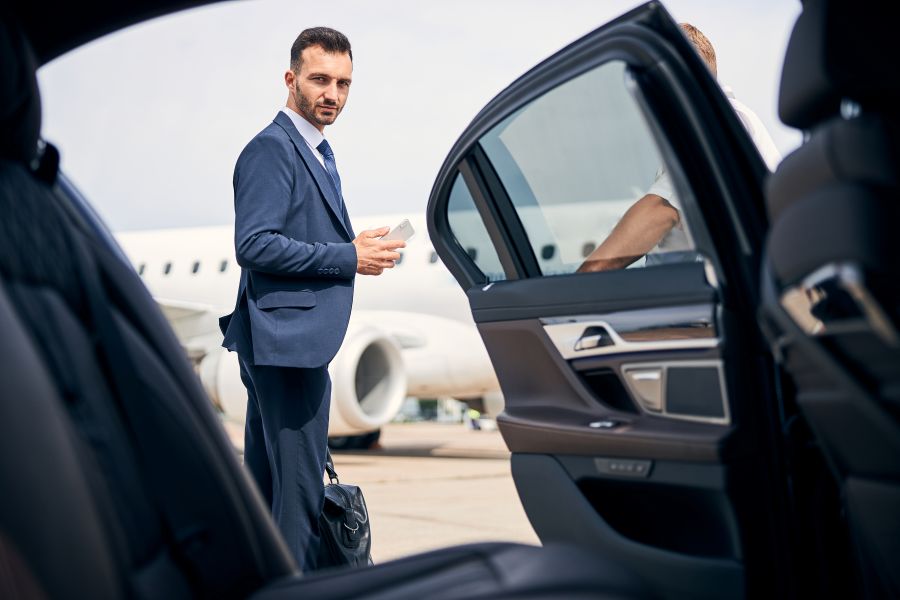 well dressed businessman arriving by plane and car 2026 01 05 22 56 31 utc